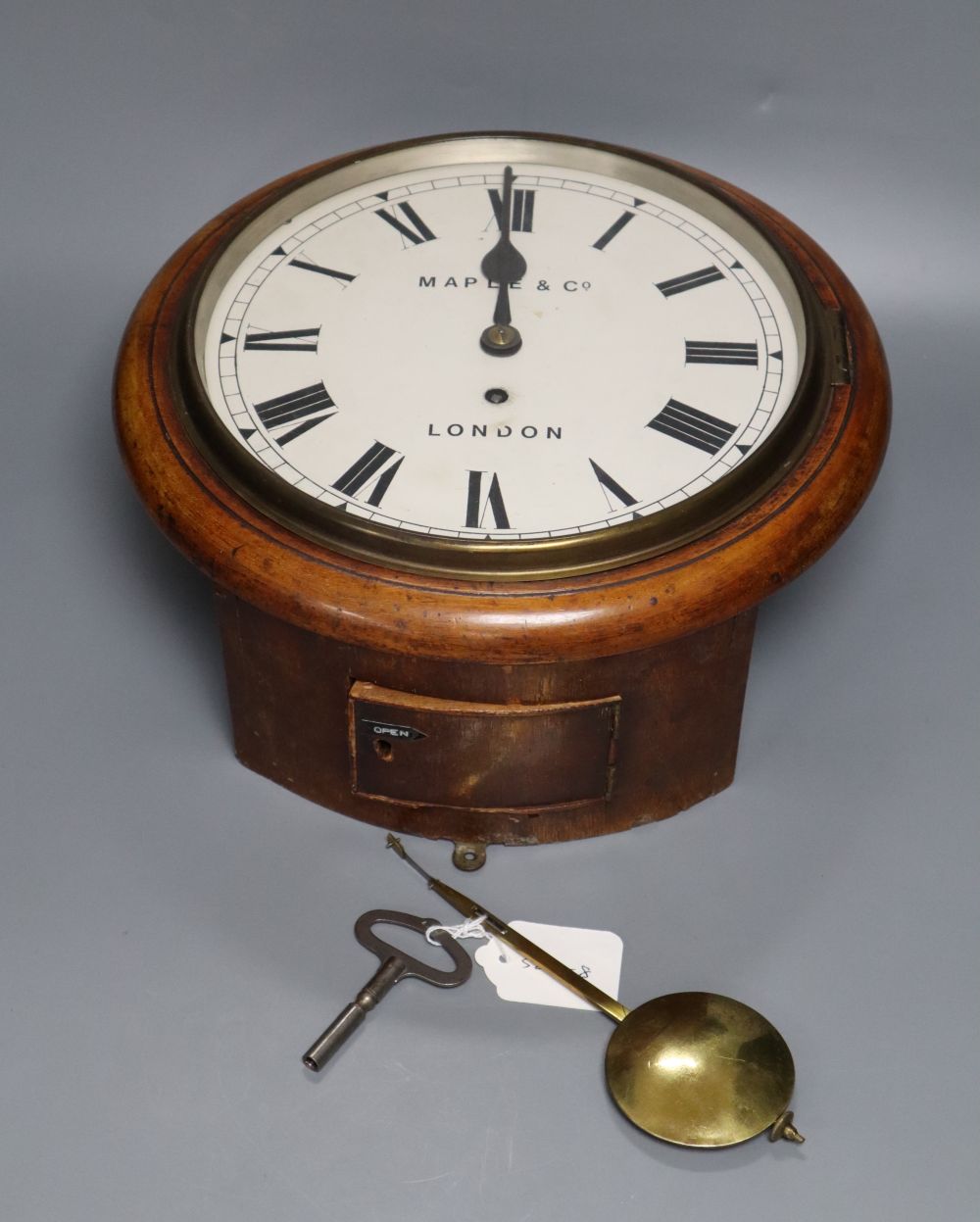 A Victorian kitchen wall clock inscribed Maple & Co, with single fusee movement, mahogany surround, dial 23cm